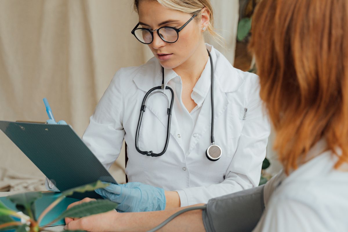 Healthcare professional speaking with a patient