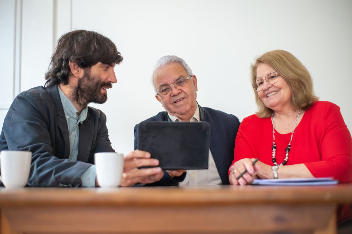 Senior couple discussing Medicare coverage with an advisor